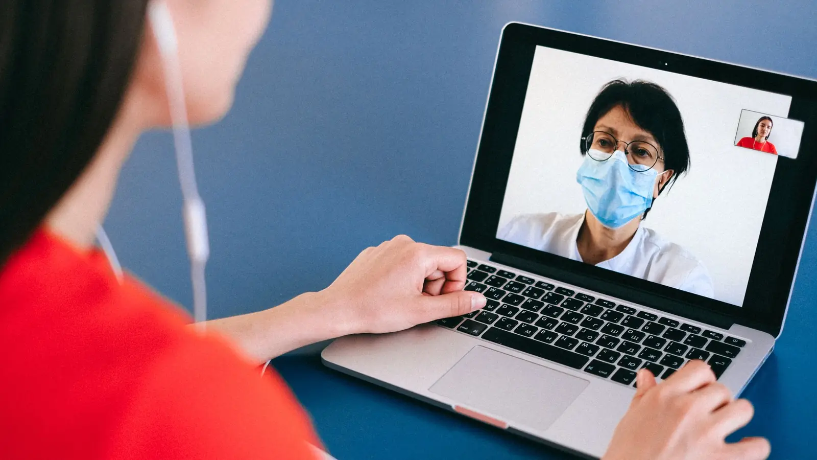 A patient at home on a video call with a doctor