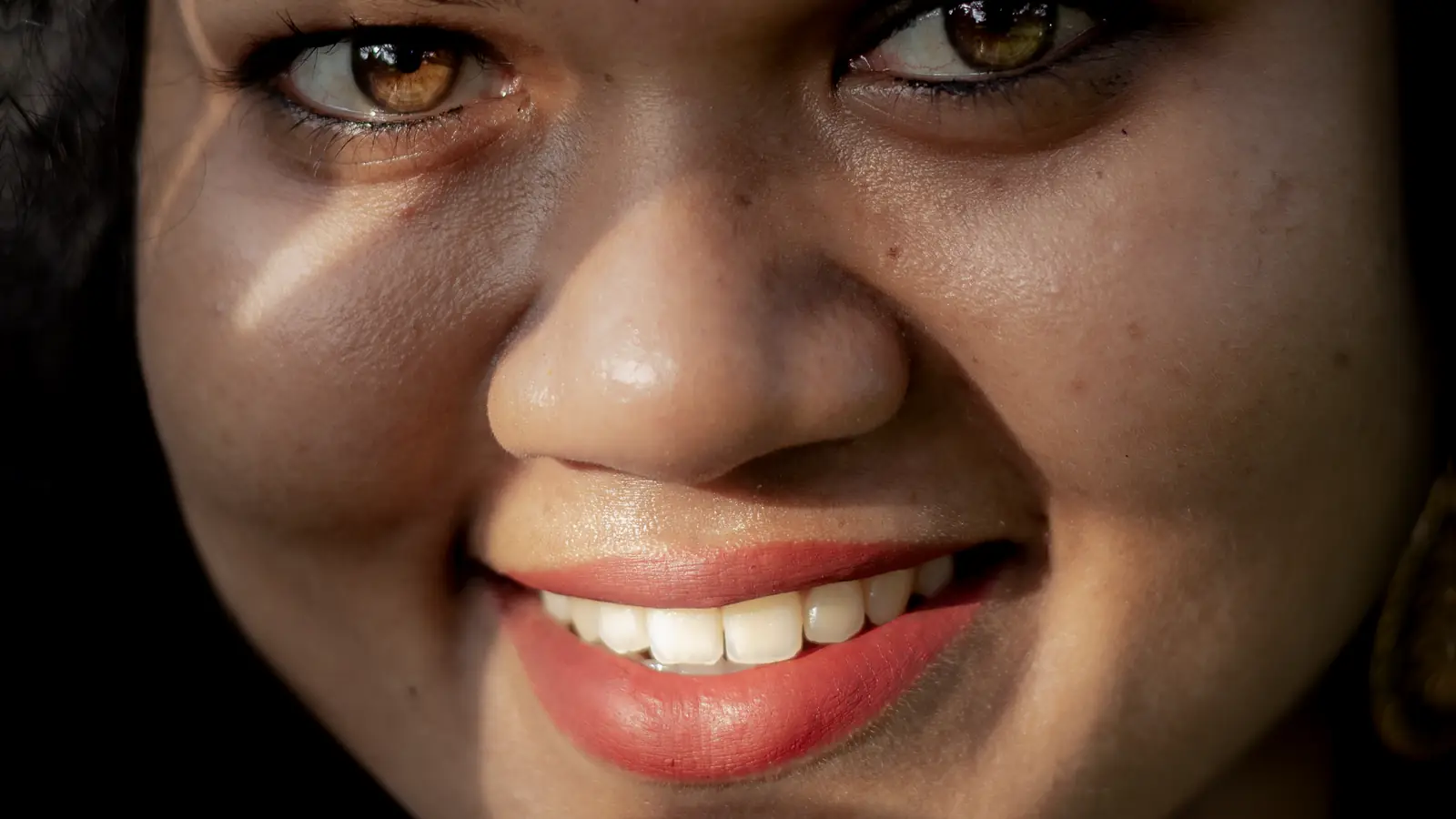 A close-up of a woman's healthy smile