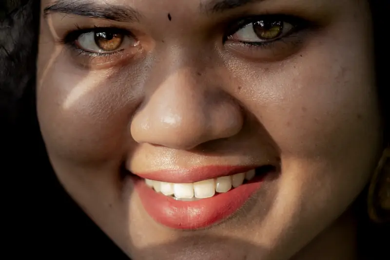 A close-up of a woman's healthy smile